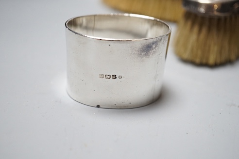 Six assorted George V silver mounted glass toilet jars, a similar brush set, a silver napkin ring and a large silver hip flask?, London, 1919, 17.3cm, 12.5oz.